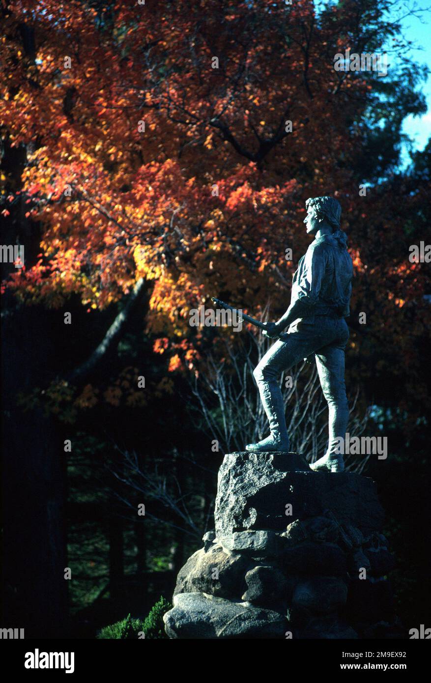 Only a few miles outside the Hanscom AFB, Massachusetts gate, the Minuteman statue proudly stands guard in Lexington's Battle Green Square. From the March 2000 AIRMAN Magazine article 'Based in Beantown,' depicting how good an assignment to Hanscom AFB, Massachusetts can be up in the Northeast. Base: Lexington State: Massachusetts (MA) Country: United States Of America (USA) Stock Photo