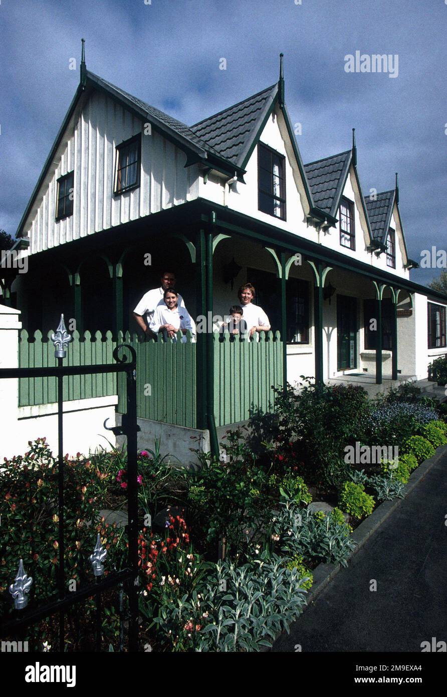 US Air Force MASTER Sergeant Eric Davis his wife Lisa, daughter Jenny, and son Kevin stand on the porch of their home at Christchurch, New Zealand where MSGT Davis is serving a three-year special duty assignment. From the March 2000 AIRMAN Magazine article, 'The 'Kiwi' Clan'. Base: Christchurch State: Canterbury Country: New Zealand (NZL) Stock Photo