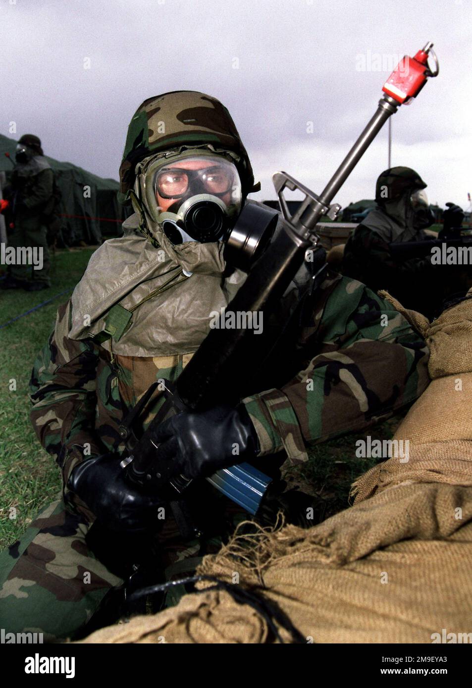 Medium close shot. A Dover team memeber maintains a defensive fighting position during the base's Battle AX exercise Dover AFB, Delaware on March 28, 2000. Base: Dover Air Force Base State: Delaware (DE) Country: United States Of America (USA) Stock Photo