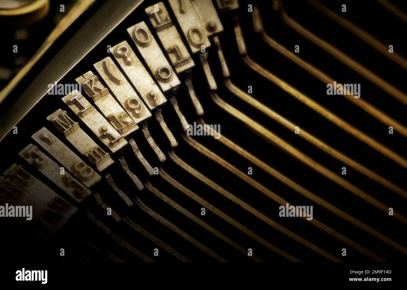 Shallow focus against type characters of an antique typewriter. Hard focus on the center of the image and soft focus at the edges edge Stock Photo