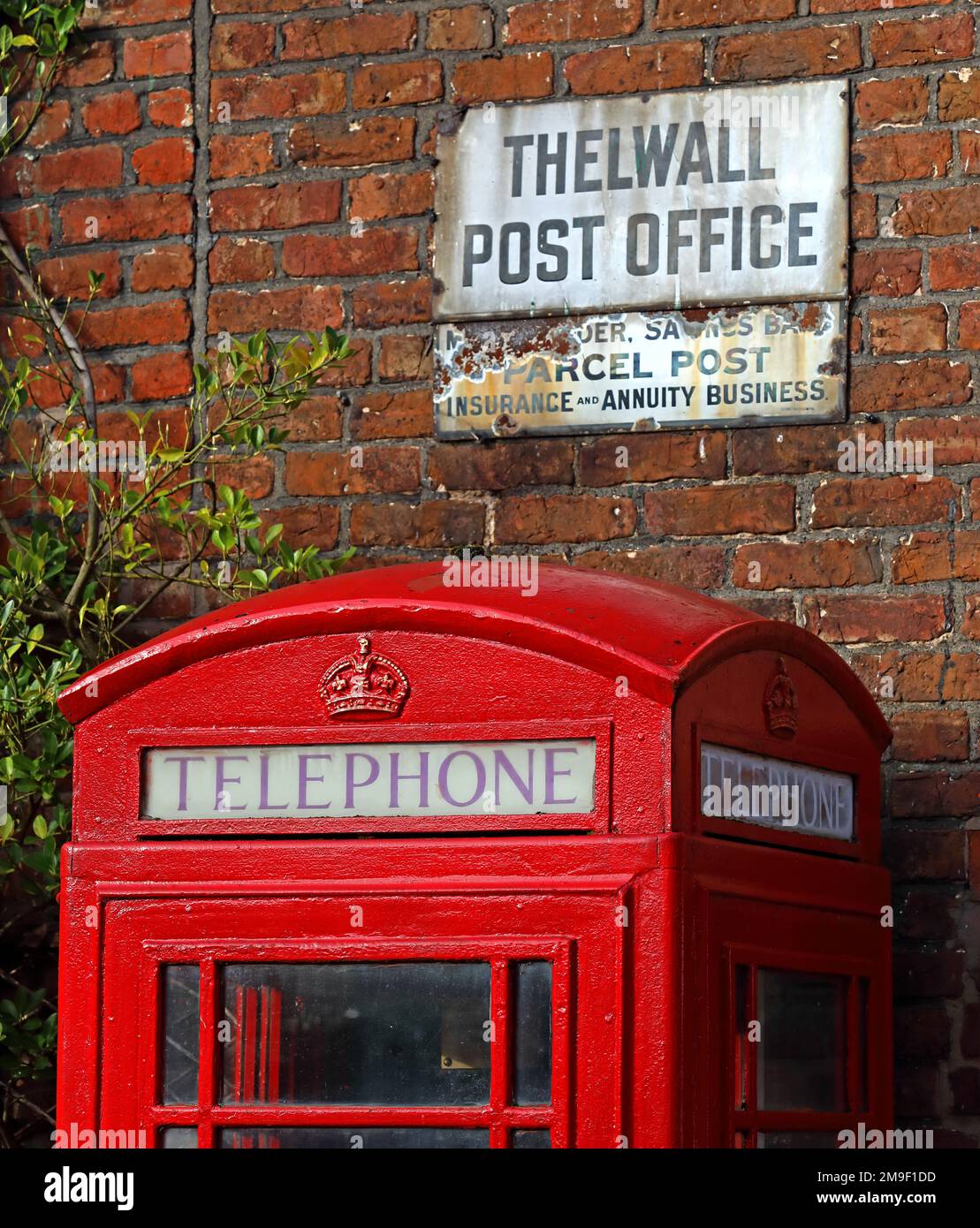 Thelwall's historic old village post office, K6 red telephone box, Bell Lane, Thelwall, South Warrington, Cheshire, England, UK, WA4 2SU Stock Photo