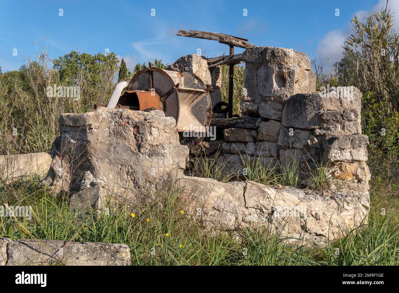 Old stone irrigation ditch in disuse and in a ruinous state. Drought problem in Spain. Island of Mallorca, Spain Stock Photo