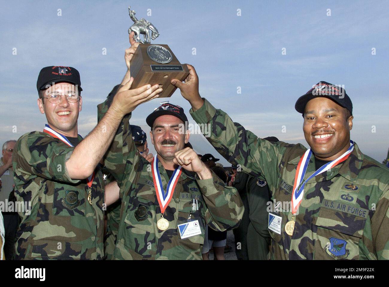 Straight on medium close-up shot as US Air Force First Lieutenant Albert Allard (Left), MASTER Sergeant Julian Hamlin (Center), and STAFF Sergeantt James Natson (Right) of the 605 Aircraft Generation Squadron, McGuire AFB, New Jersey after winning the KC-10 Extender maintenance pre-flight (KC-10 not shown) event at the awards ceremony on May 11, 2000 during the Rodeo 2000 readiness competition at Pope AFB. During the one week competition, more than 100 teams and 2,500 personnel from over 300 Air Force, Air Force Reserve, Air National Guard, U.S. Army units, and foreign nations will compete in Stock Photo