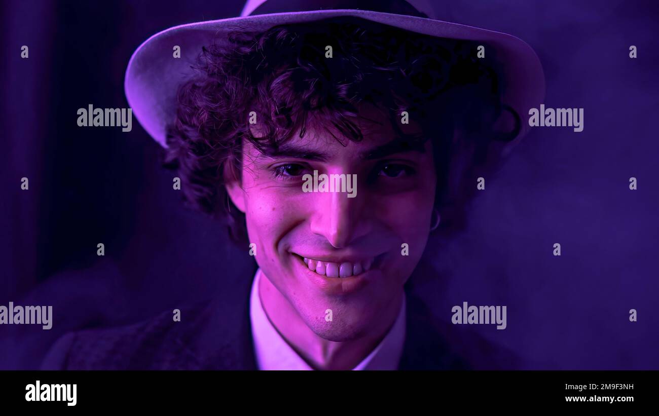 a-young-man-with-dark-brown-hair-is-happily-singing-and-dancing-with