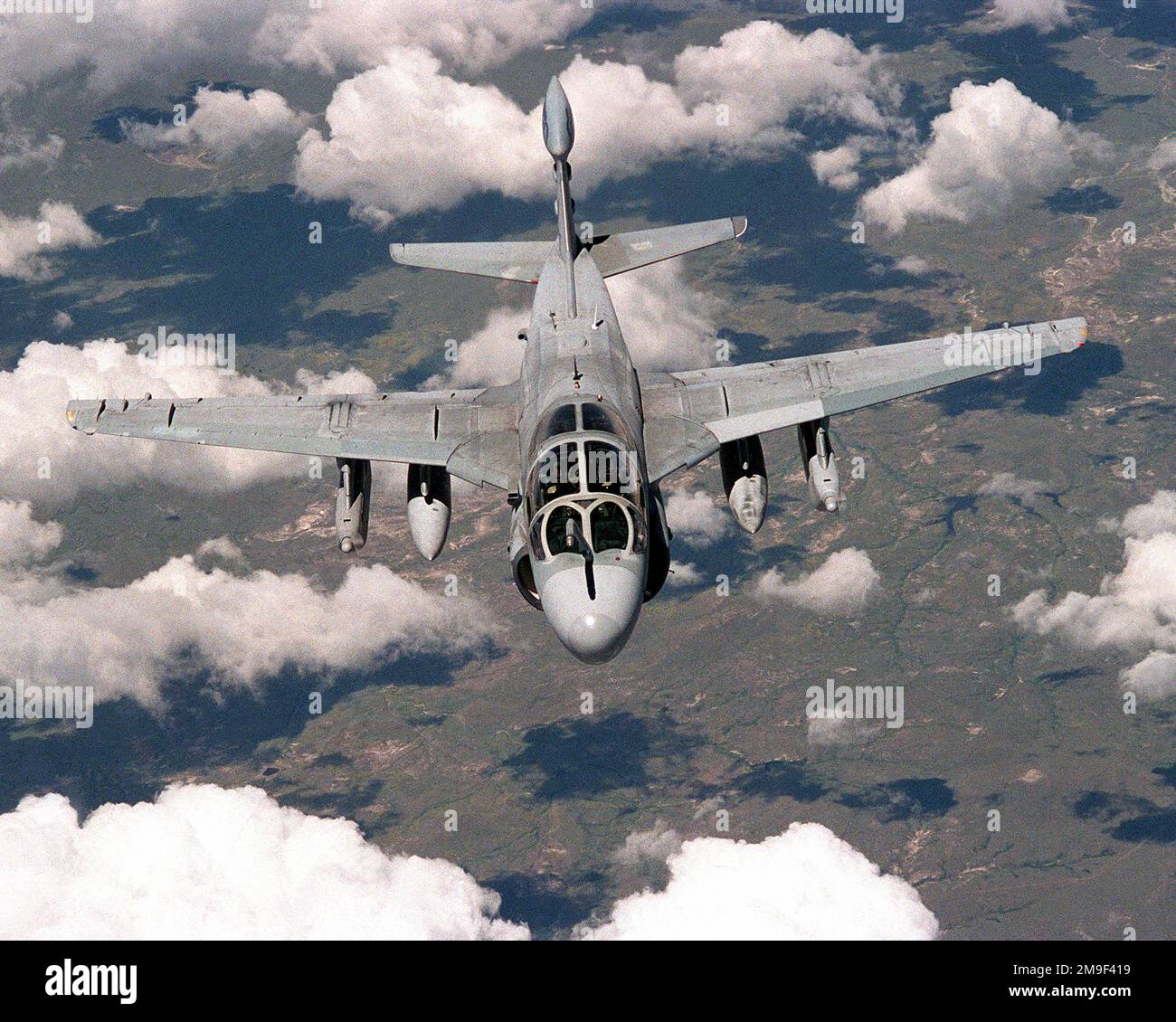 An Electronic Warfare Squadron Marine Attack Squadron 4 (VMA-Q4) EA6-B Prowler aircraft from Marine Corps Air Station Cherry Point, North Carolina, flys under an Air Force KC-10 (not shown) after refueling on its way to Cold Lake Canada for Operation MAPLE FLAG 00. Subject Operation/Series: MAPLE FLAG 00 Country: Unknown Stock Photo