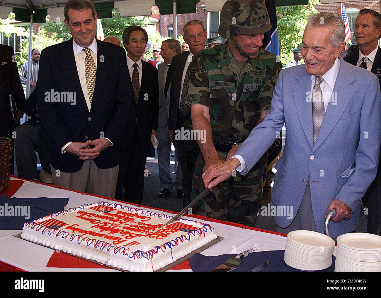 US Army General John W. Hendrix, Commanding General Forces Command, and US Army Lieutenant General (retired) Louis W. Truman, oldest living Korean War veteran and former 3rd US Army Commander, cut the birthday cake for the 225th Army birthday and 50th anniversary of the Korean War. Watching from the left are Mr. Gaden Thompson, Deputy Undersecretary of the Army for International Affairs and Mr. Kwang-Sok Ryu, Consul General of the Republic of Korea in Atlanta. Base: Fort Mcpherson State: Georgia (GA) Country: United States Of America (USA) Stock Photo