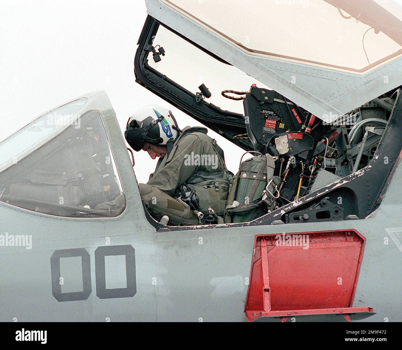 US Marine Corps Major Hull, from Electronic Warfare Squadron Marine Attack Squadron 4 (VMA-Q4), from Marine Corps Air Station Cherry Point, North Carolina, gets in the cockpit of his EA6-B Prowler aircraft ready for his flight duging Nato operation MAPLE FLAG 00 in Cold Lake, Canada. Subject Operation/Series: MAPLE FLAG 00 Base: Cold Lake State: Alberta (AB) Country: Canada (CAN) Stock Photo