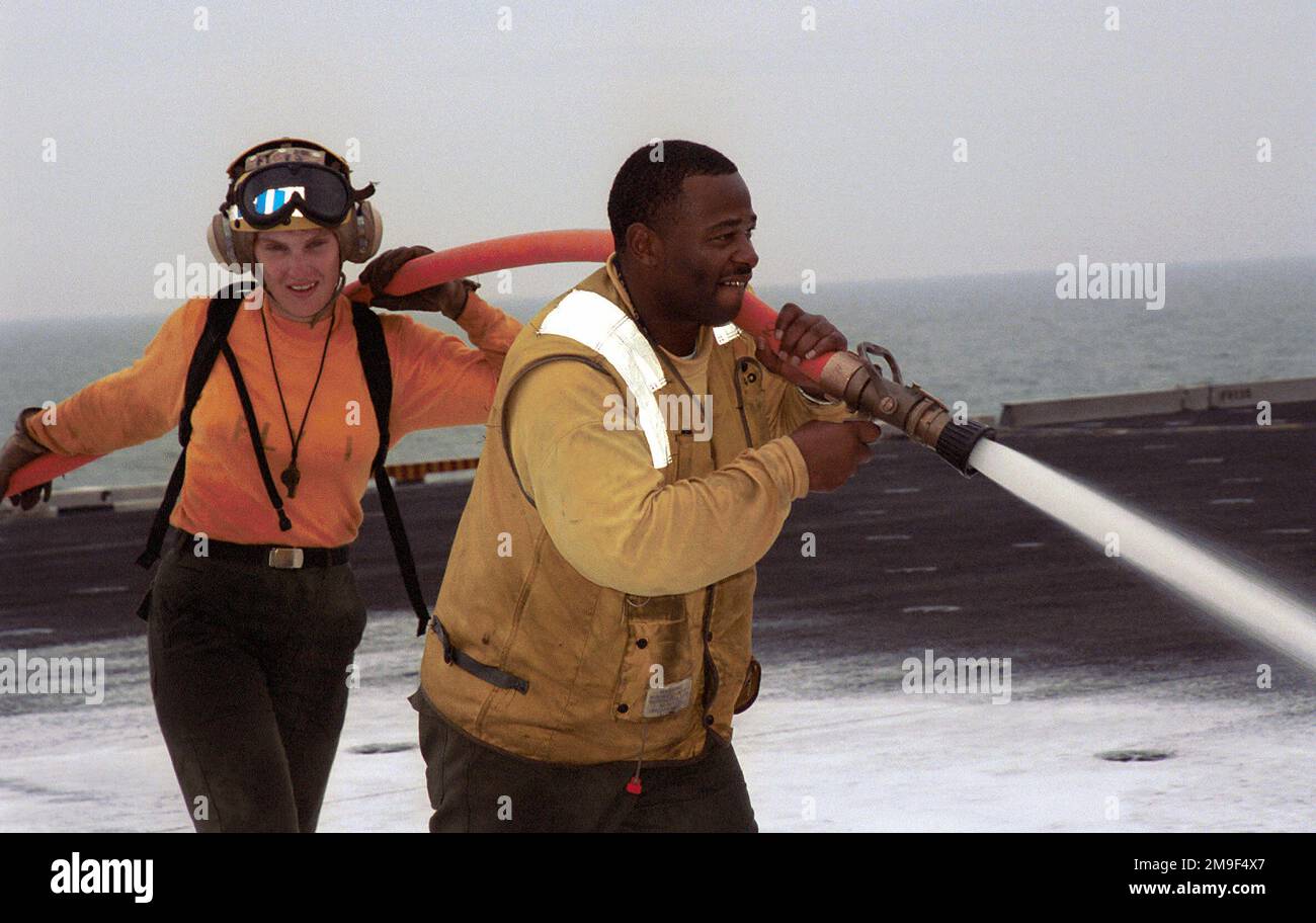 AIRMAN Amy Baker and Aviation Boatswain Mate Handler Second Class