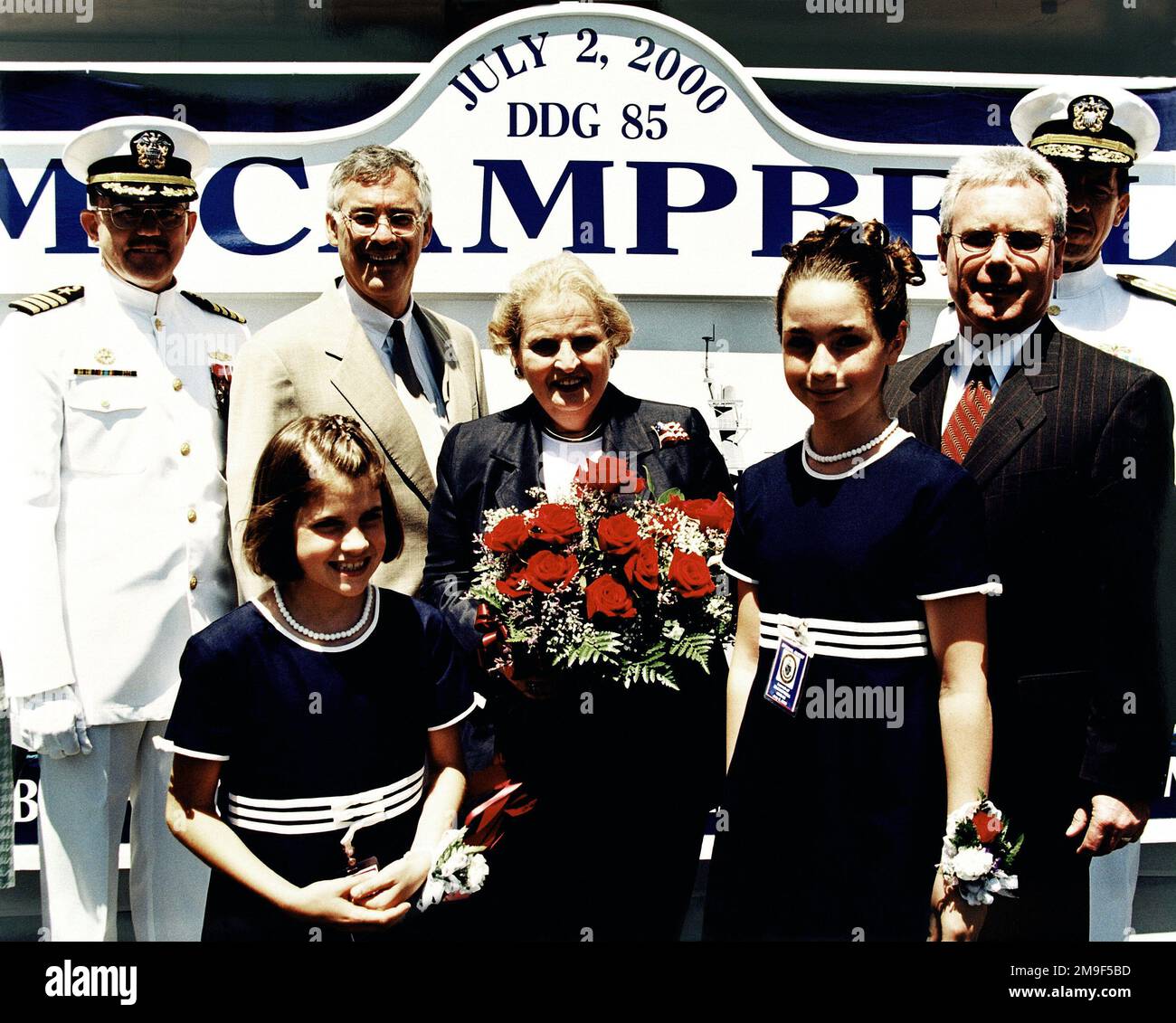The christening party for the USS MCCAMPBELL (DDG 85) is from left to right, Captain R. Hepburn, USN, Hon. Richard Danzig, Secretary of the Navy, Hon. Madeline K. Albright, Secretary of State and Ship's sponsor, Mr. Allen Cameron, President and CEO of Bath Iron Works, Rear Admiral Michael M. Mullen, USN. In the foreground are the Maids of Honor, Miss Levesque and Miss Moore. Base: Bath State: Maine (ME) Country: United States Of America (USA) Stock Photo