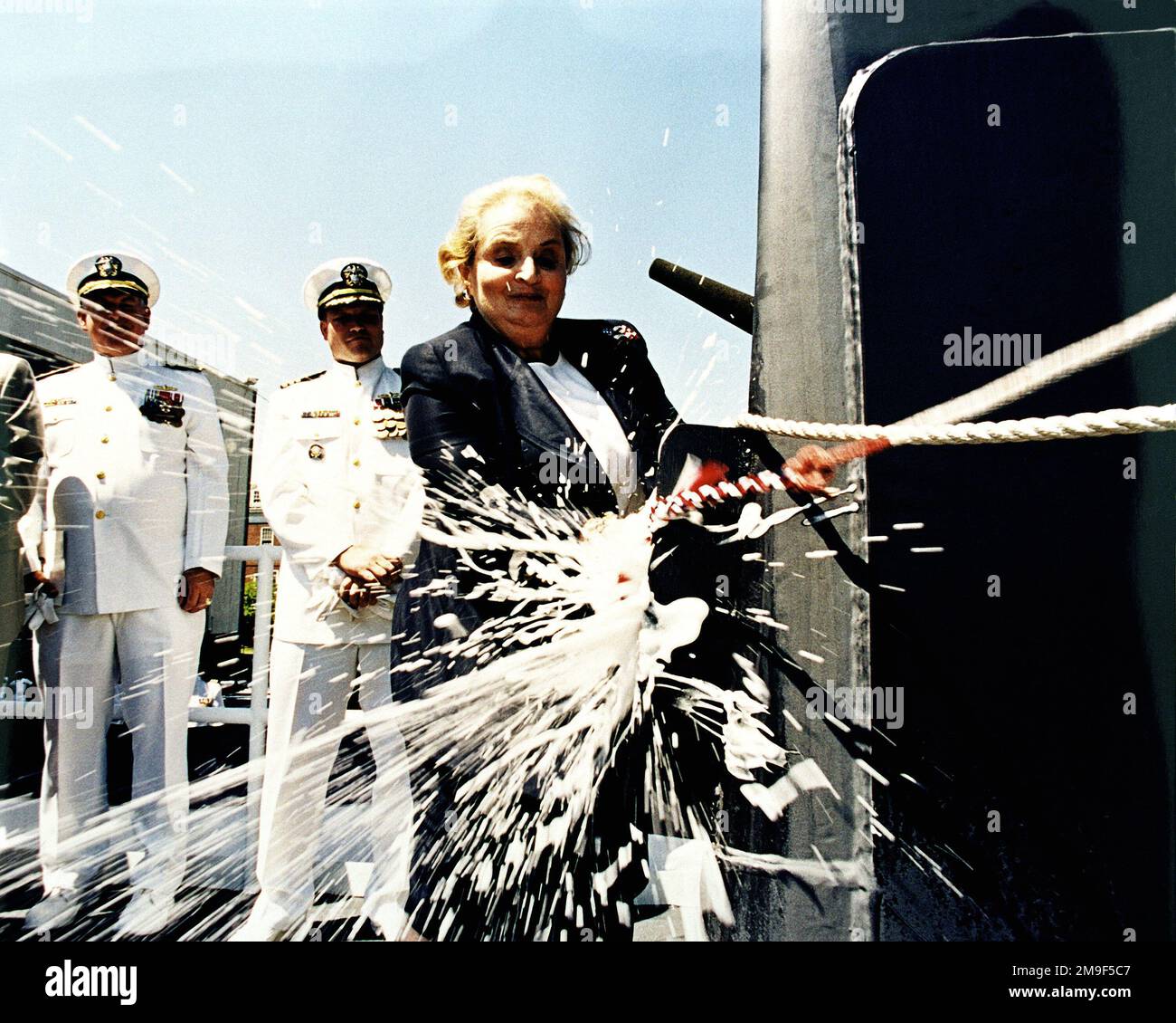 The Honorable Madeline K. Albright, Secretary of State and Ship's sponsor, breaks the traditional bottle of champagne over the prowl of the Arleigh Burke Block IIA Aegis Class Guided Missile Destroyer USS MCCAMPBELL (DDG 85) at the conclusion of the christening and launch ceremony at the Bath Iron Works Shipyard on the Kennebec River. Base: Bath State: Maine (ME) Country: United States Of America (USA) Stock Photo