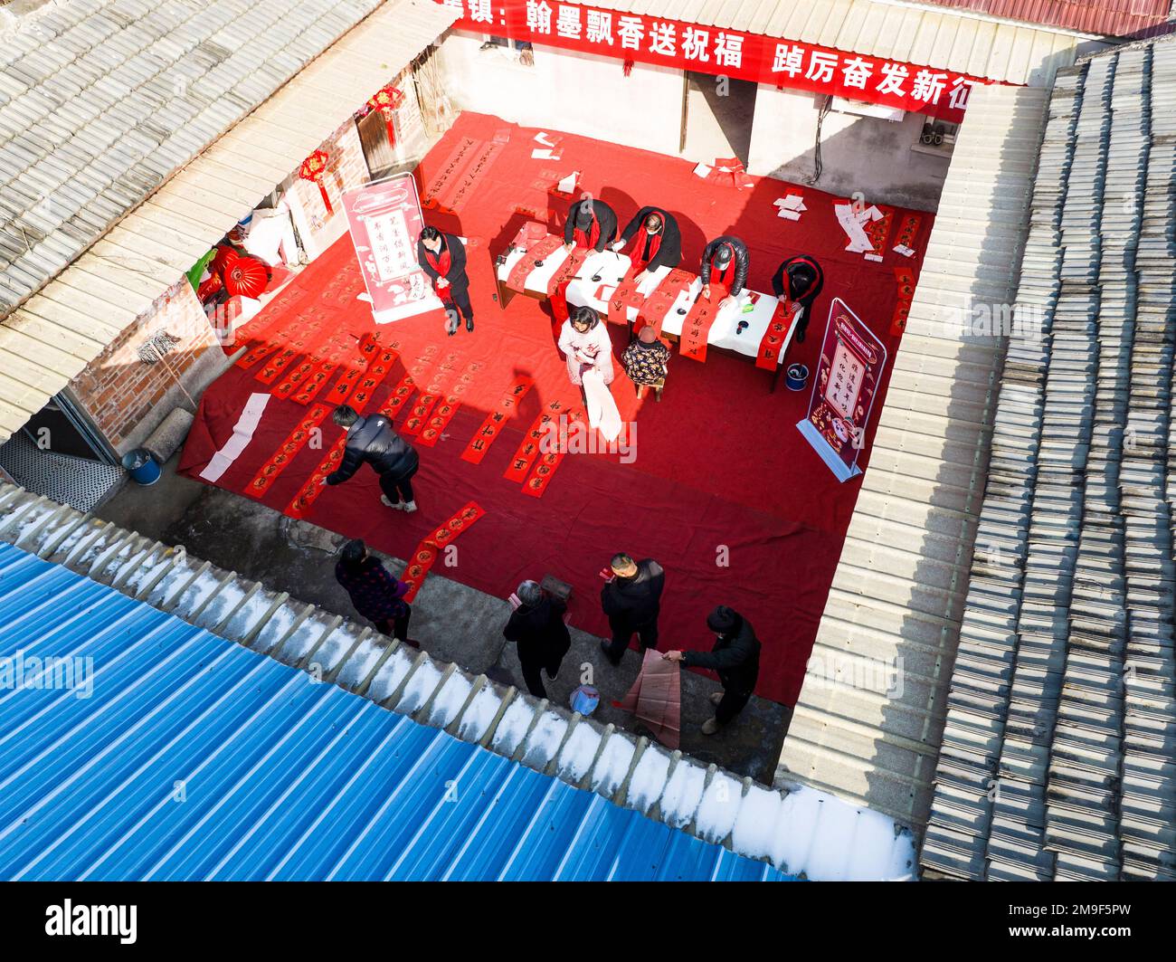 SUQIAN, CHINA - JANUARY 18, 2023 - Calligraphers wrote couplets to citizens to celebrate the lunar Year of the Rabbit. January 18, 2023, Suqian City, Stock Photo