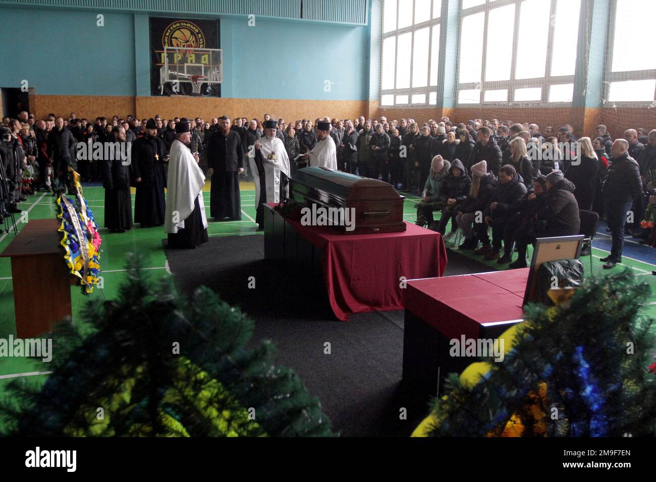 DNIPRO, UKRAINE - JANUARY 17, 2023 - Priests conduct the funeral service of Ukrainian boxer, Merited Coach of Ukraine and head coach of the boxing tea Stock Photo
