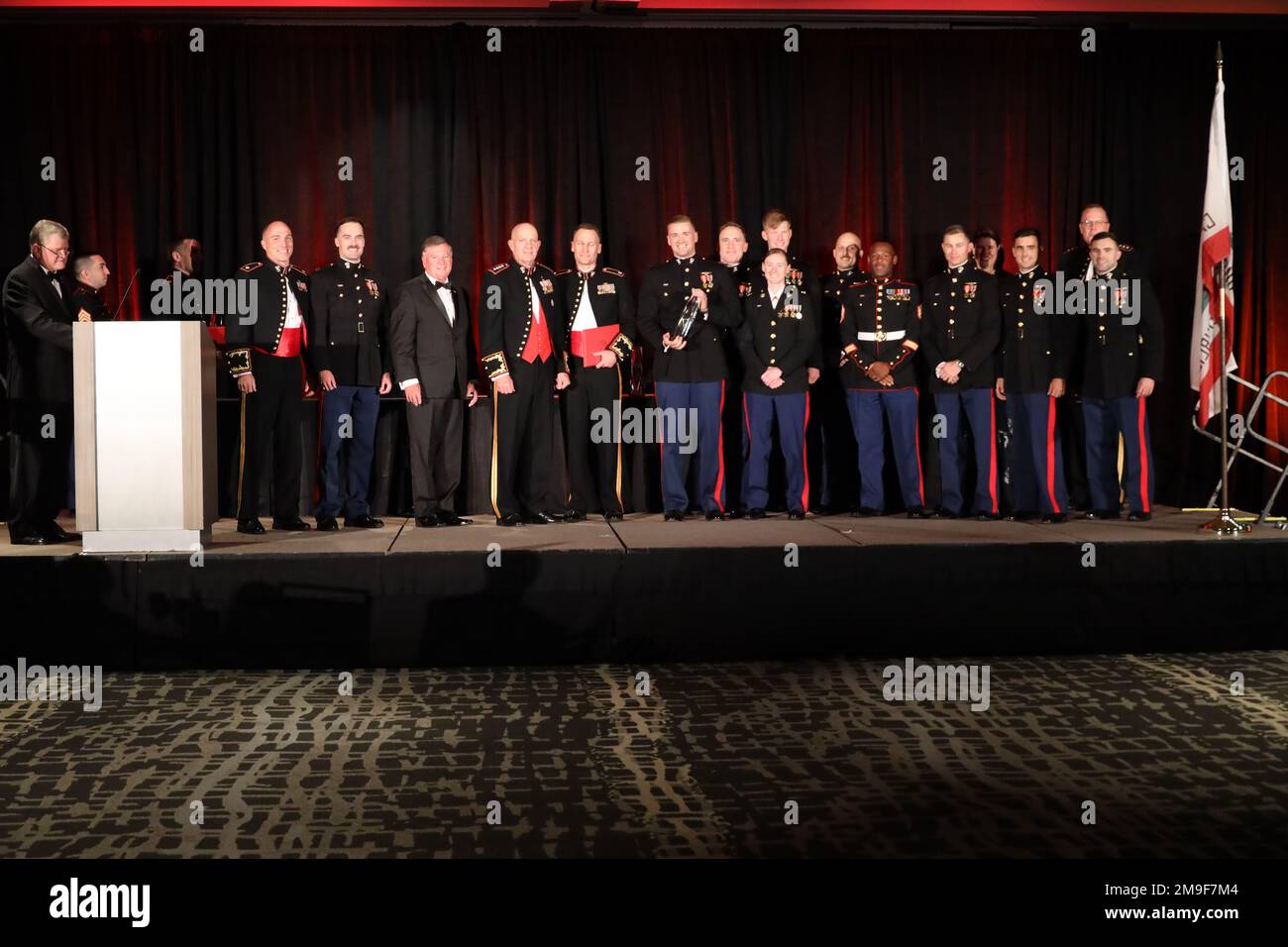 U.S. Marine Corps Gen. David H. Berger, the commandant of the Marine Corps, presents the  Robert M. Hanson award to the Marines of Marine Fighter Attack Squadron 211, 3rd Marine Aircraft Wing, during the 2022 Marine Corps Aviation Association awards banquet in San Diego, California, May 19, 2022. The MCAA held a weeklong symposium for active duty Marines and association members where they could learn about new innovations in military aviation and attend the awards banquet where the top aviators in the Marine Corps were recognized. Stock Photo