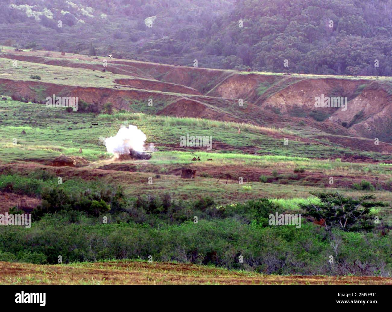 1ST Battalion, 3rd Marines Anti Armor Squad (Not shown) takes out a target with the Dragon Missile at Army Schofield Barracks Training Field, Kaneohe Bay, Hawaii, on August 24th, 2000. Base: Schofield Barracks, Kaneohe Bay State: Hawaii (HI) Country: United States Of America (USA) Stock Photo
