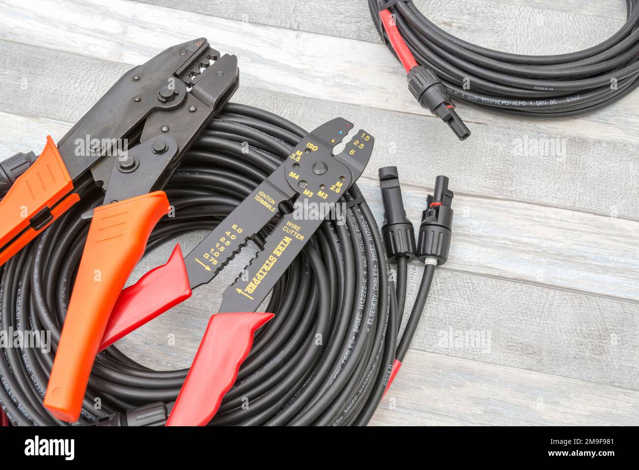 Chinese made unbranded wire stripper & wire cutter for 26-10AWG wire (see Notes) + unbranded MC4 Solar connector hand crimping tool & MC4 connectors. Stock Photo