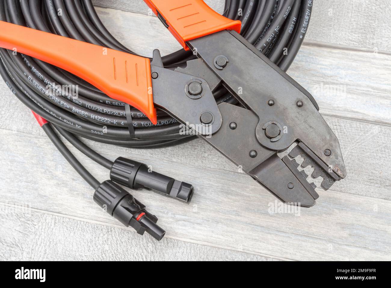 Chinese made unbranded MC4 Solar connector hand crimping tool & solar connector cables with MC4 connectors + black branded 4mm² Elsewedy cable. Stock Photo