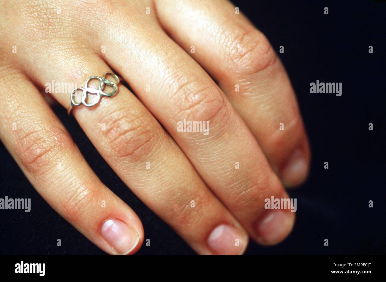 Straight on, extreme close-up of the right hand of Olympic Gold ...