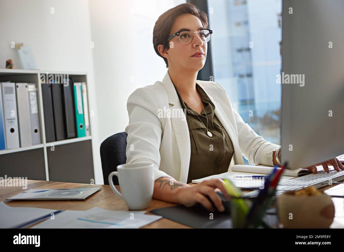 Computer, research and business woman in office typing online documents, website database and writing email. Corporate, networking and busy female Stock Photo