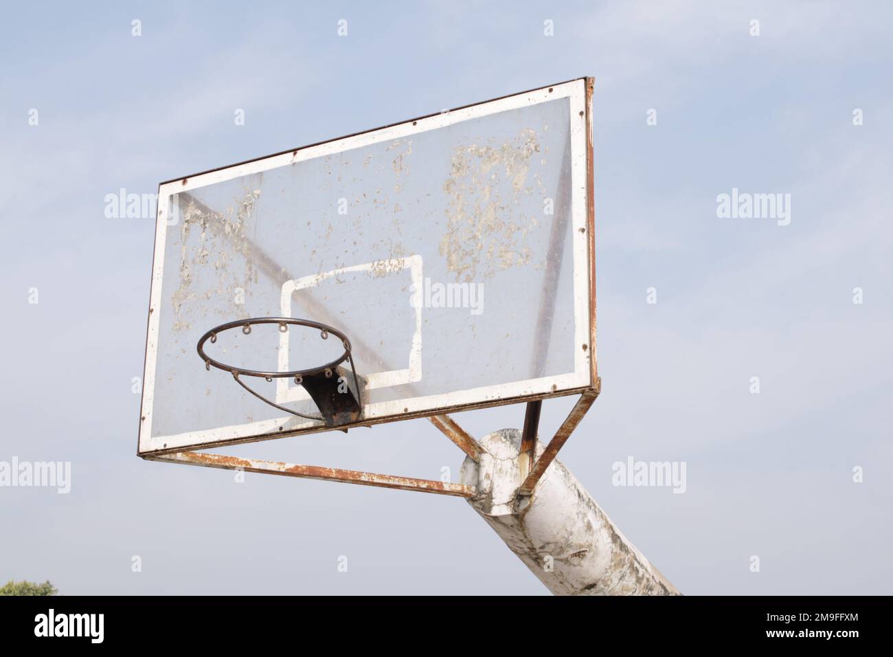 Basketball hoop on blue sky with clouds background Stock Photo