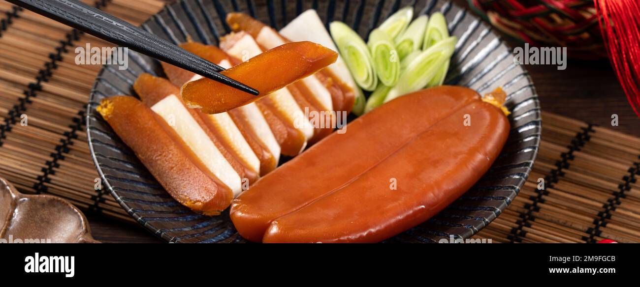 Delicious fresh mullet roe with white radish slices and garlic sprout ...