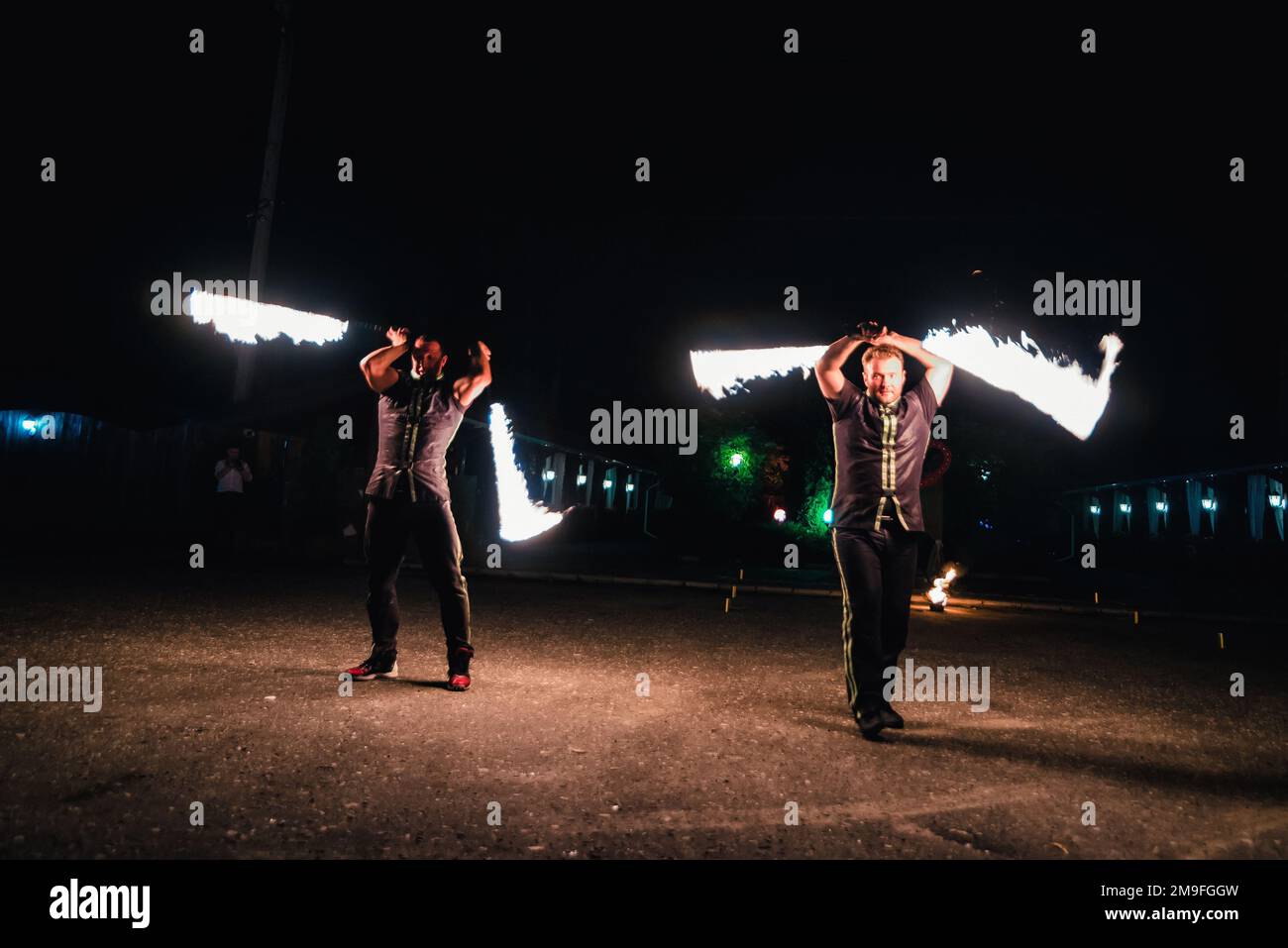 IVANOVO, RUSSIA - AUGUST 23, 2016: Professional performers dancers with fiery sparkling torches performed a dangerous fire show Stock Photo