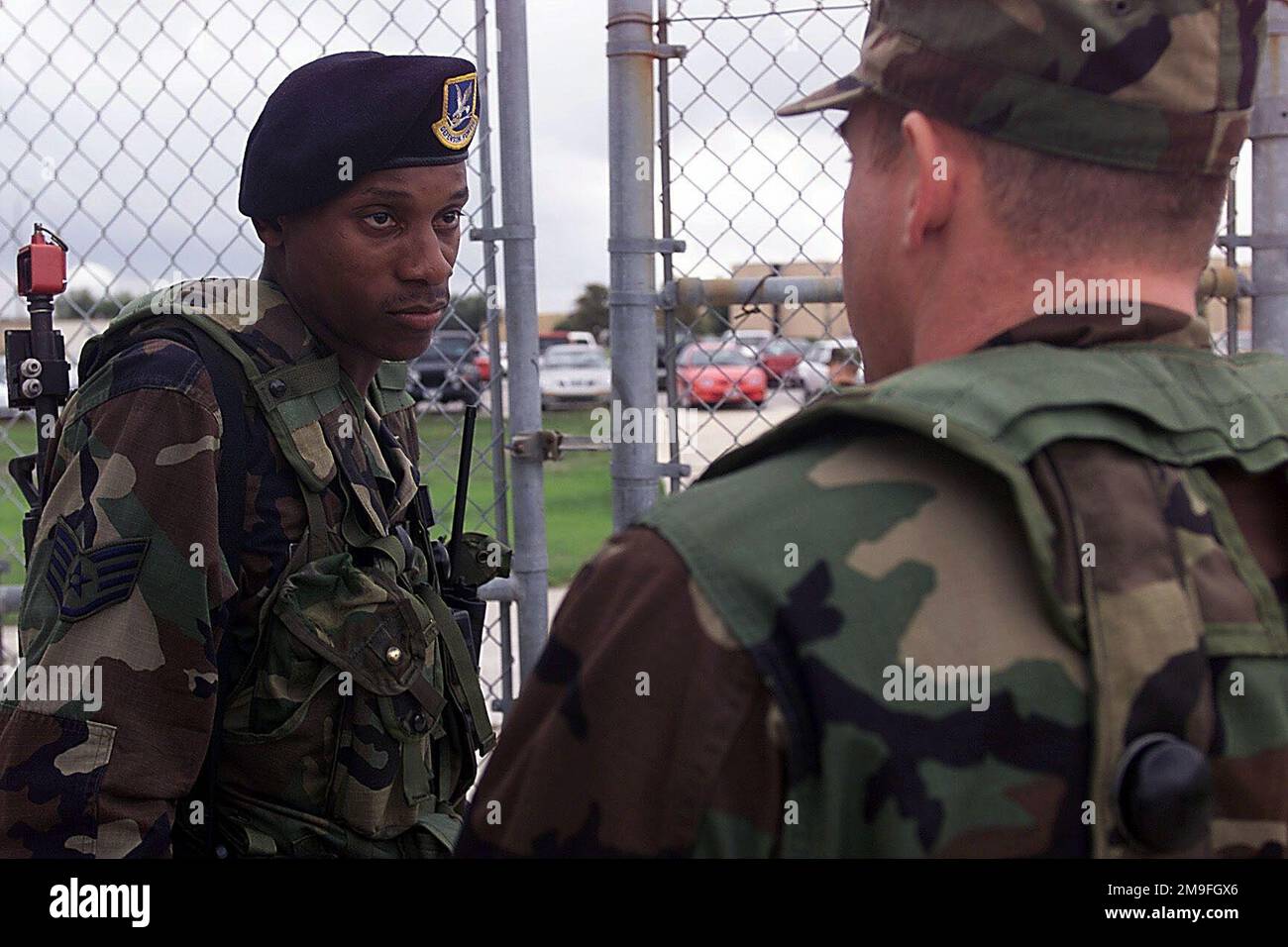 US Air Force STAFF Sergeant Duane Fowler, Air Force Reserve Command, verifies identification from US Air Force Captain James Jefferson in the Base Response event during DEFENDER CHALLENGE 2000 at Lackland Air Force Base, Texas, on Oct. 31, 2000. Defender Challenge is the annual Air Force wide competition sponsored by Air Force Security Forces. This competition showcases the talents and capabilities of 13 international Security Forces teams in 24 events six days. Subject Operation/Series: DEFENDER CHALLENGE '00 Base: Lackland Air Force Base State: Texas (TX) Country: United States Of America (U Stock Photo