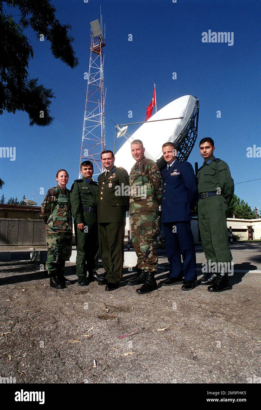 (left to right) US Air Force Captain Andrea Gormel, 39th Wing CHIEF of Military Justice, First Lieutenant Kader Sumer, Turkish Air Force Communications Squadron Commander, Captain Oktay Seyifoglu, Turkish General STAFF CHIEF Communication Electronics Information Representative, USAF Lieutenant Colonel John Nolan, 39th Communications Squadron Commander, USAF CAPT Don Carter, Communications officer and interpreter with the Office of Defense Cooperation in Ankara, and 1LT Birol Guvenc, Turkish Air Force Communications Squadron Division Commander, pose for a group photo during the Defense and Econ Stock Photo