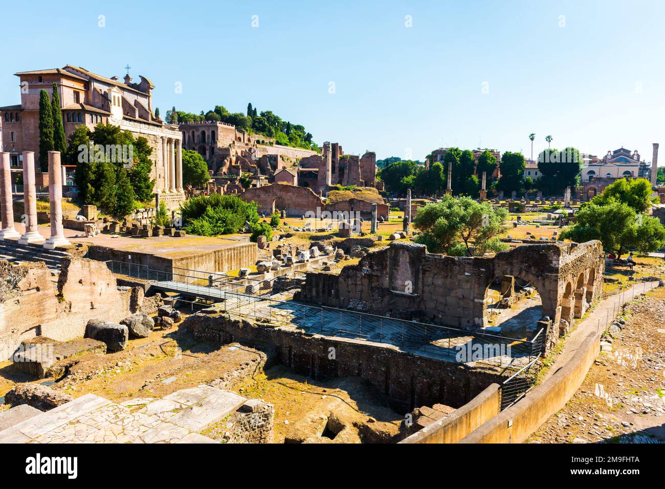 The ancient Roman Forum in Rome, Italy. Roman Forum was ancient Rome's showpiece centre and a grandiose district of temples. Stock Photo