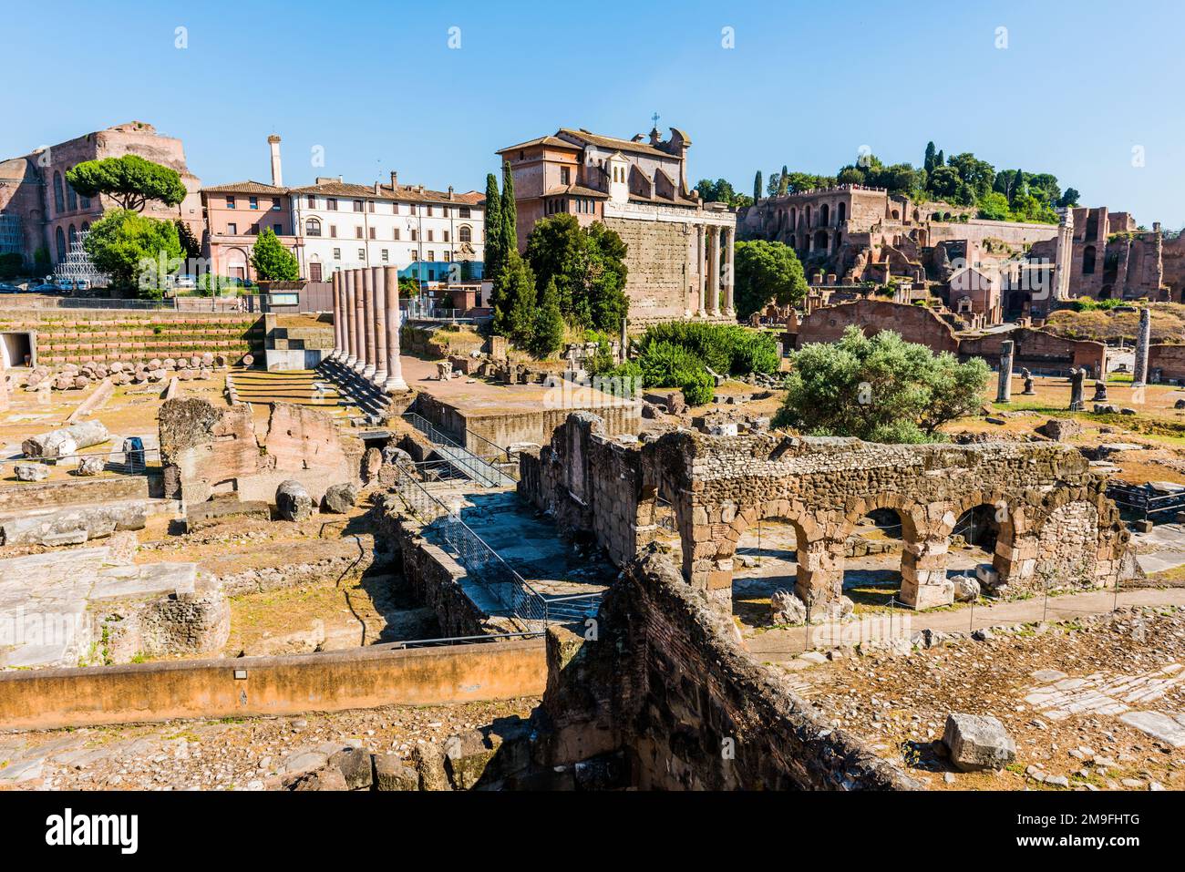 The ancient Roman Forum in Rome, Italy. Roman Forum was ancient Rome's showpiece centre and a grandiose district of temples. Stock Photo