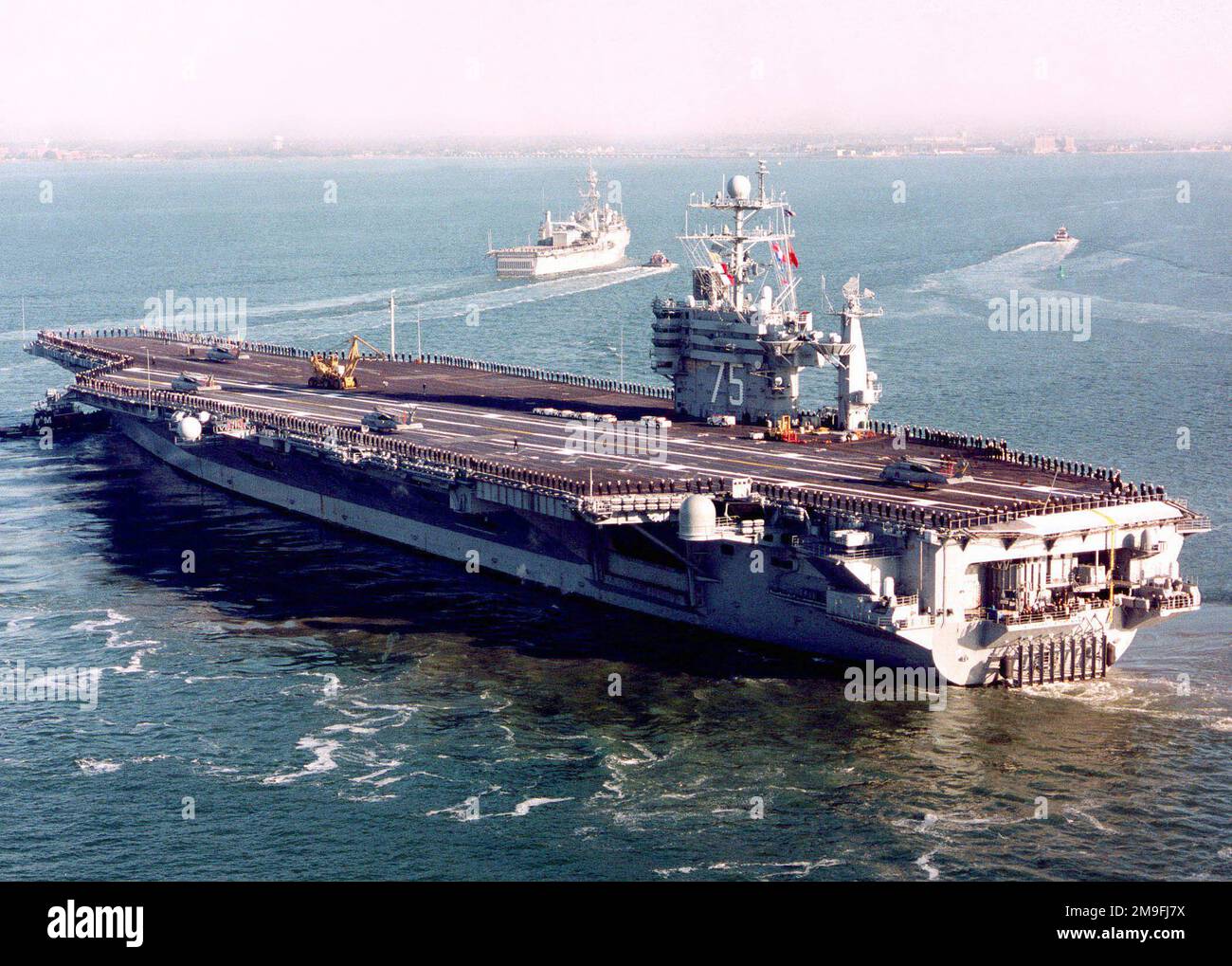 Mannig The Rails Sailors stationed aboard the USS HARRY S. TRUMAN (CVN 75) man the rails ...