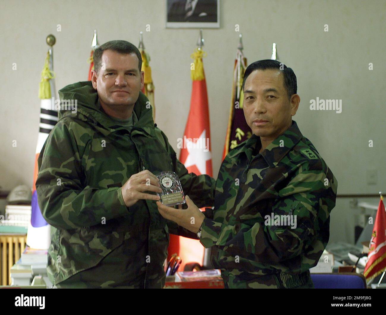 Chaplin Edward L. Milliner 2nd Battalion, 7th Marines Regiment, presents Major General Sang Kee Bae 1ST Battalion, 7th Marine Regiment, with a token of all the Marines appreciation for his cooperation with Korean Intergrated Training Program (KITP). KITP is a one and a half month joint training in conjunction with the Republic of Korea (ROK) Marines that takes place in Pohang, Korea, Marine Expeditionary Camp Pohang (MEC-P). Base: Mec-Pohang Country: Republic Of Korea (KOR) Stock Photo