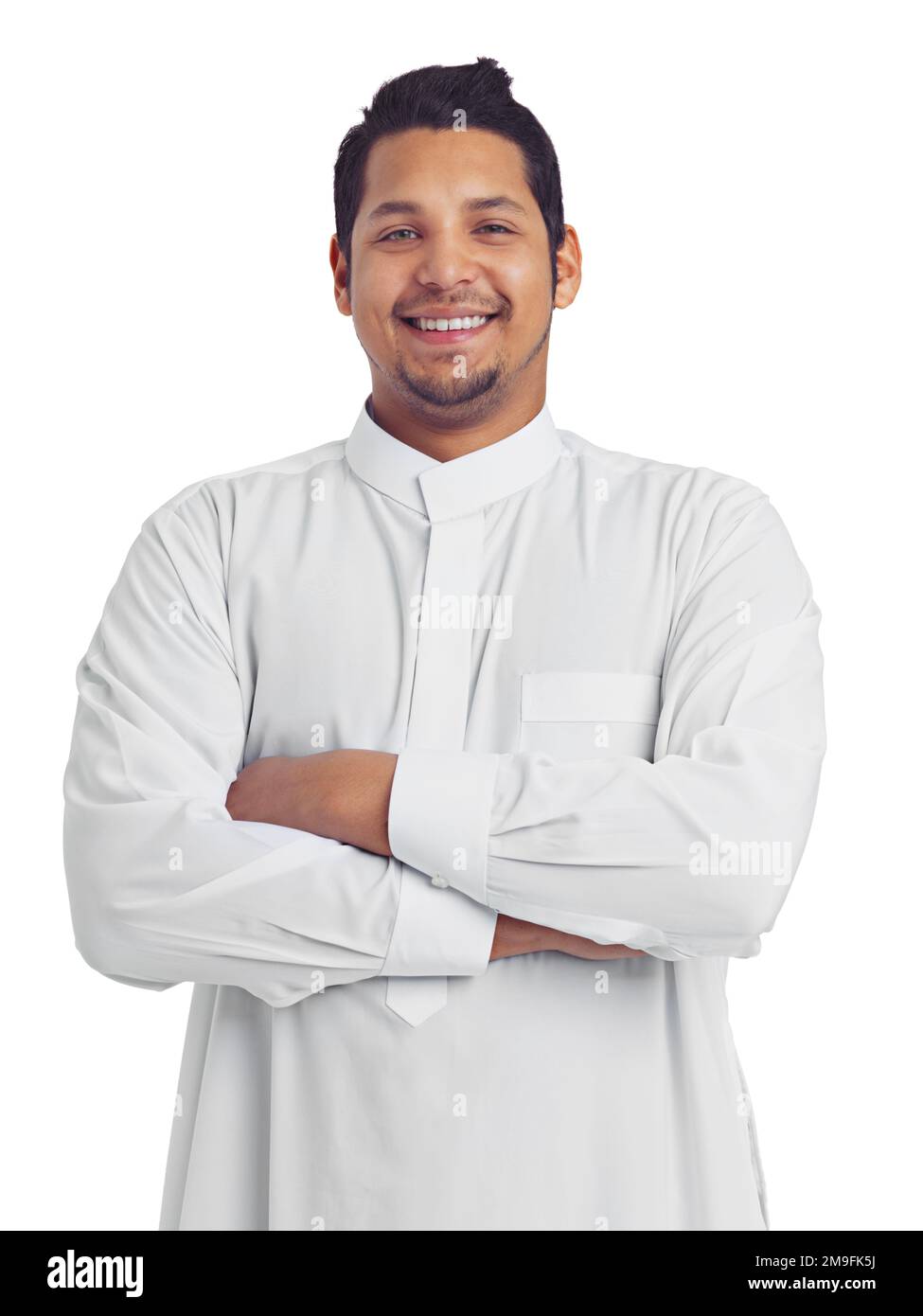 Muslim man, studio portrait and arms crossed isolated on white background for religion, arabic clothes and faith. Happy moslem guy, spiritual leader Stock Photo