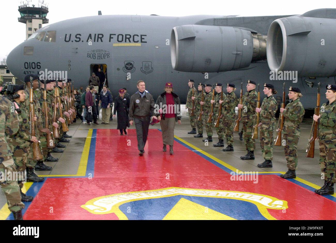 Secretary of Defense William S. Cohen and his wife, Mrs. Janet Langhart Cohen, walk along the Honor Cordon at Ramstein Air Base, Germany. This was the first stop on the European leg of the tour of the Secretary of Defense Holiday Show 2000. Base: Ramstein Air Base State: Rheinland-Pfalz Country: Deutschland / Germany (DEU) Stock Photo