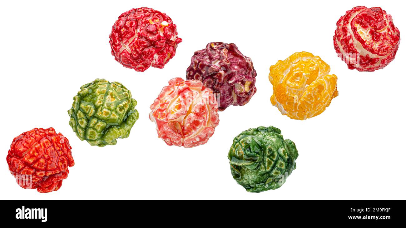 Falling colorful popcorn isolated on white background Stock Photo