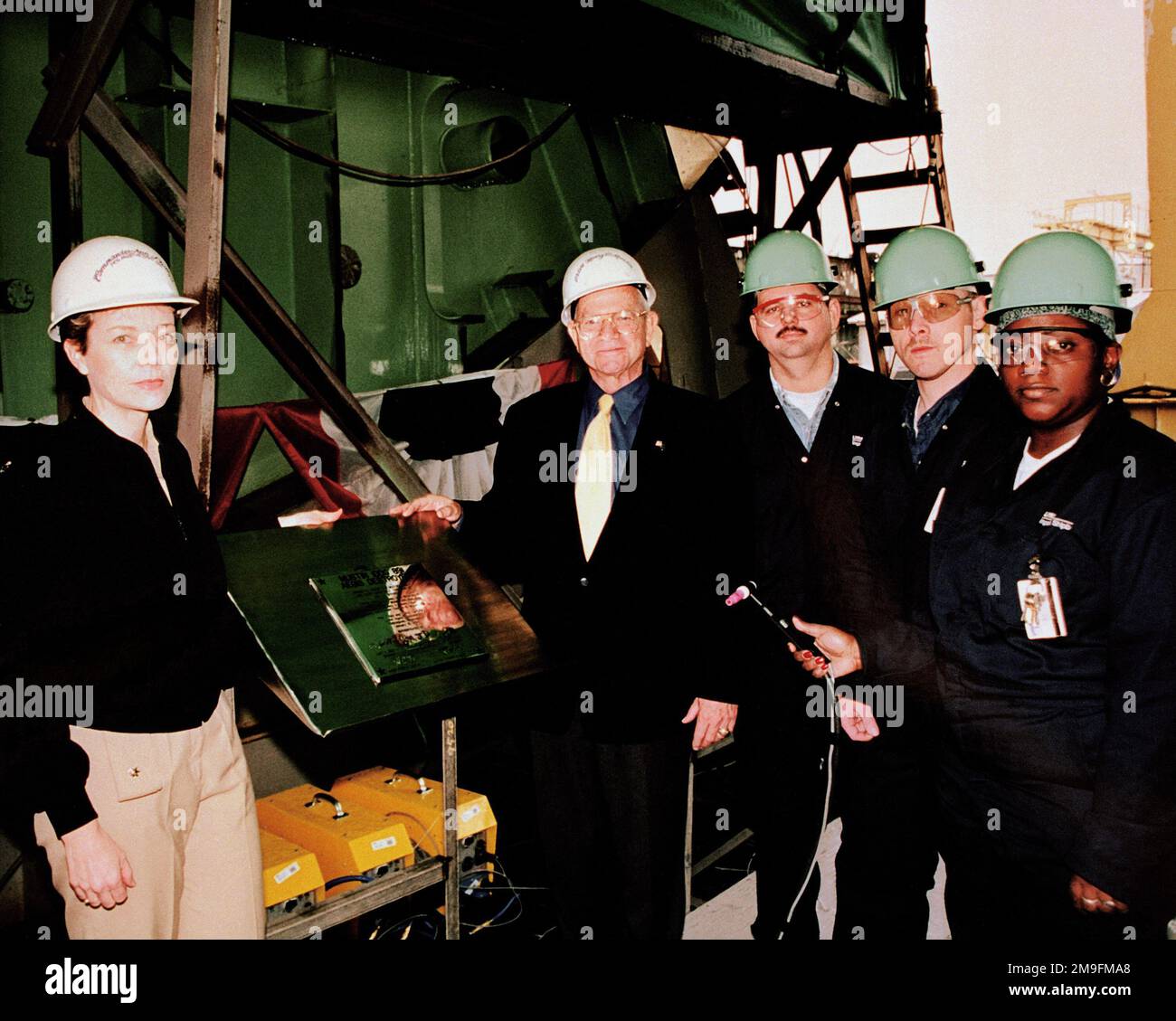 Welders prepare to make the first marking cuts during the keel laying