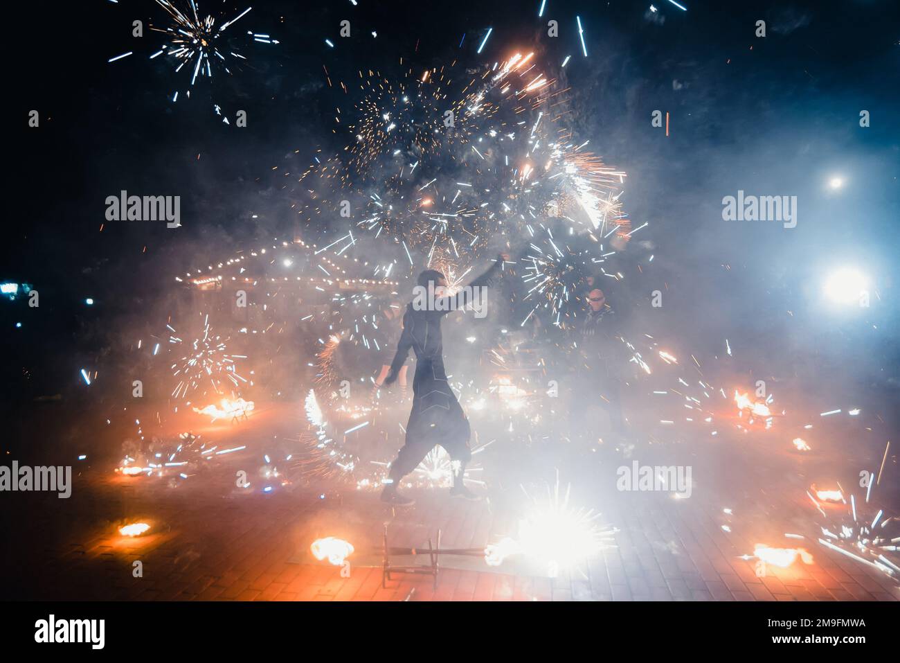 SEMIGORYE, IVANOVO OBLAST, RUSSIA - JULY 16, 2016: Dangerous fire show from the team of professional performers with burning torches and sparks Stock Photo