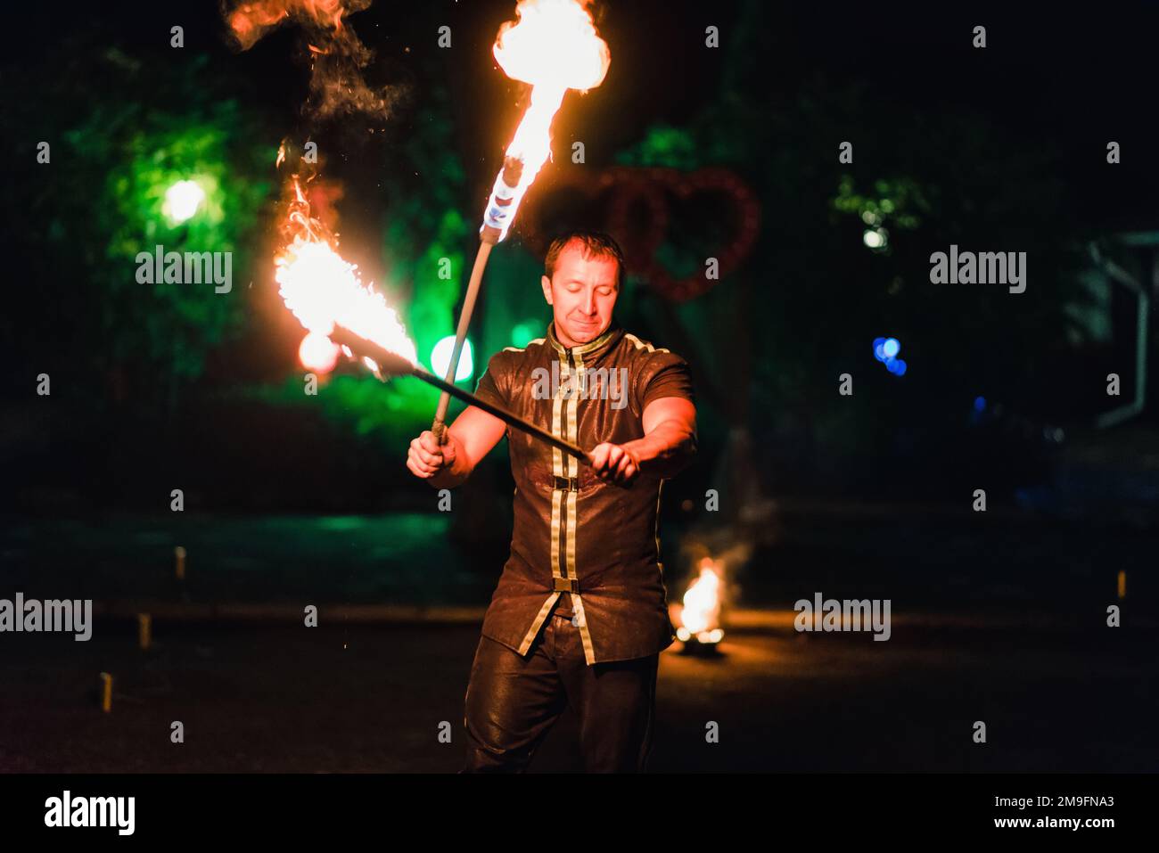 IVANOVO, RUSSIA - AUGUST 23, 2016: Professional performers dancers with fiery sparkling torches performed a dangerous fire show Stock Photo