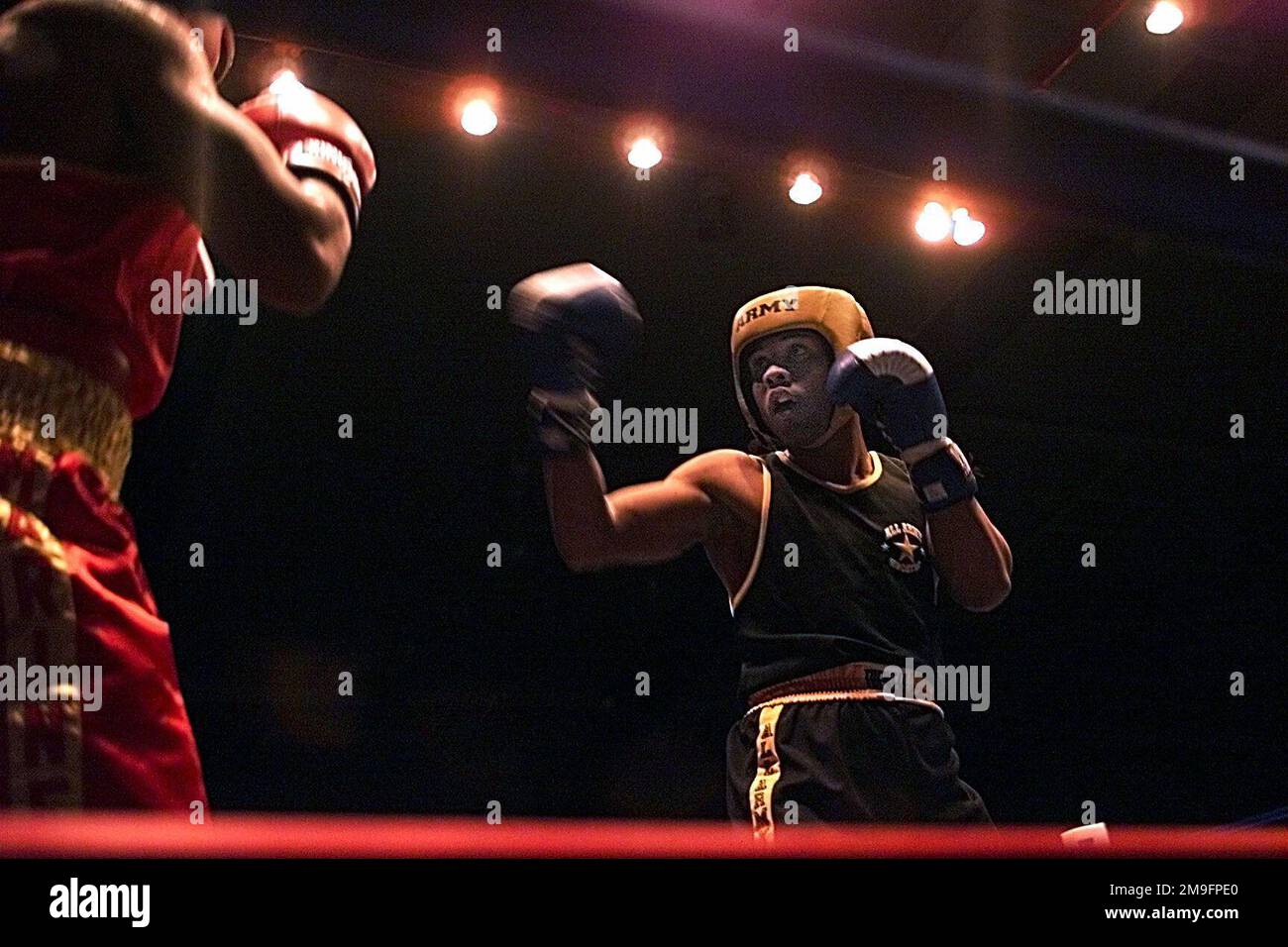 US Marine Corps boxer Steven Stokes (Left) and US Army boxer Yamar Resto square off in the ring during this year's Armed Forces Boxing Competition at Fort Huachuca, Arizona, on February 7th, 2001. Base: Fort Huachuca State: Arizona (AZ) Country: United States Of America (USA) Stock Photo