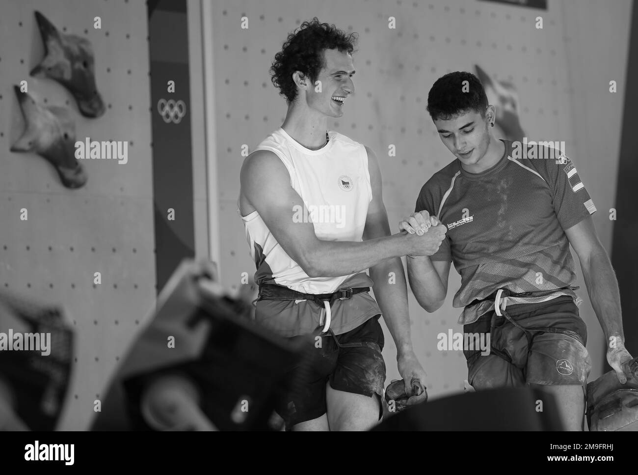 AUG 5, 2021 - TOKYO, JAPAN: Alberto GINES LOPEZ of Spain and Adam ONDRA of Czech Republic handshake after competing in the Sport Climbing Men's Combin Stock Photo