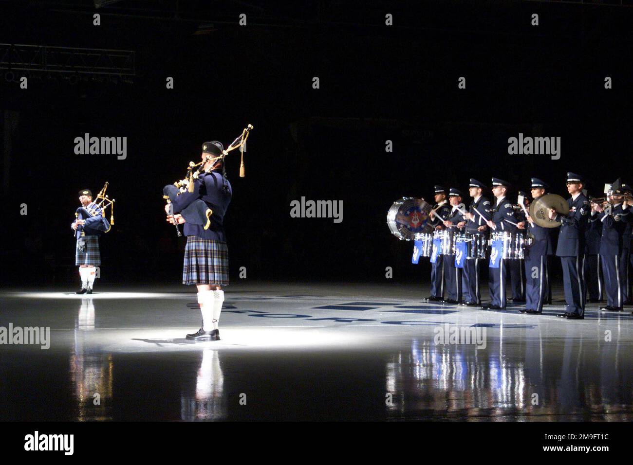 Two pipers from the US Air Force Reserve Pipe band play their bagpipes