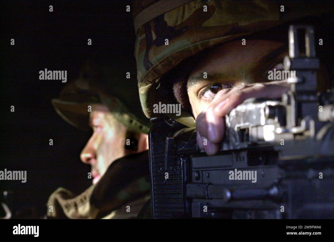 US Air Force AIRMAN First Class William Maddox, 51st Security Forces Squadron, Osan Air Base, Republic of Korea, mans an M-60 machine gun in a defensive fighting position during Osan's Operational Readiness Inspection (ORI). Base: Osan Air Base Country: Republic Of Korea (KOR) Stock Photo