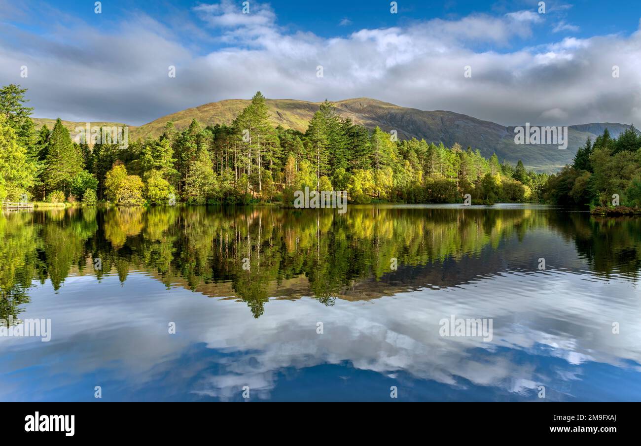 The Glencoe Lochan with an early morning light reflection. Glencoe ...