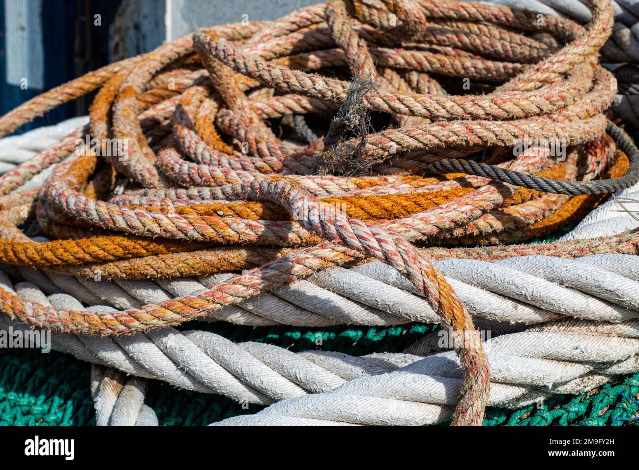 Fishing ropes and nets in the fishing port of Blanes Stock Photo - Alamy