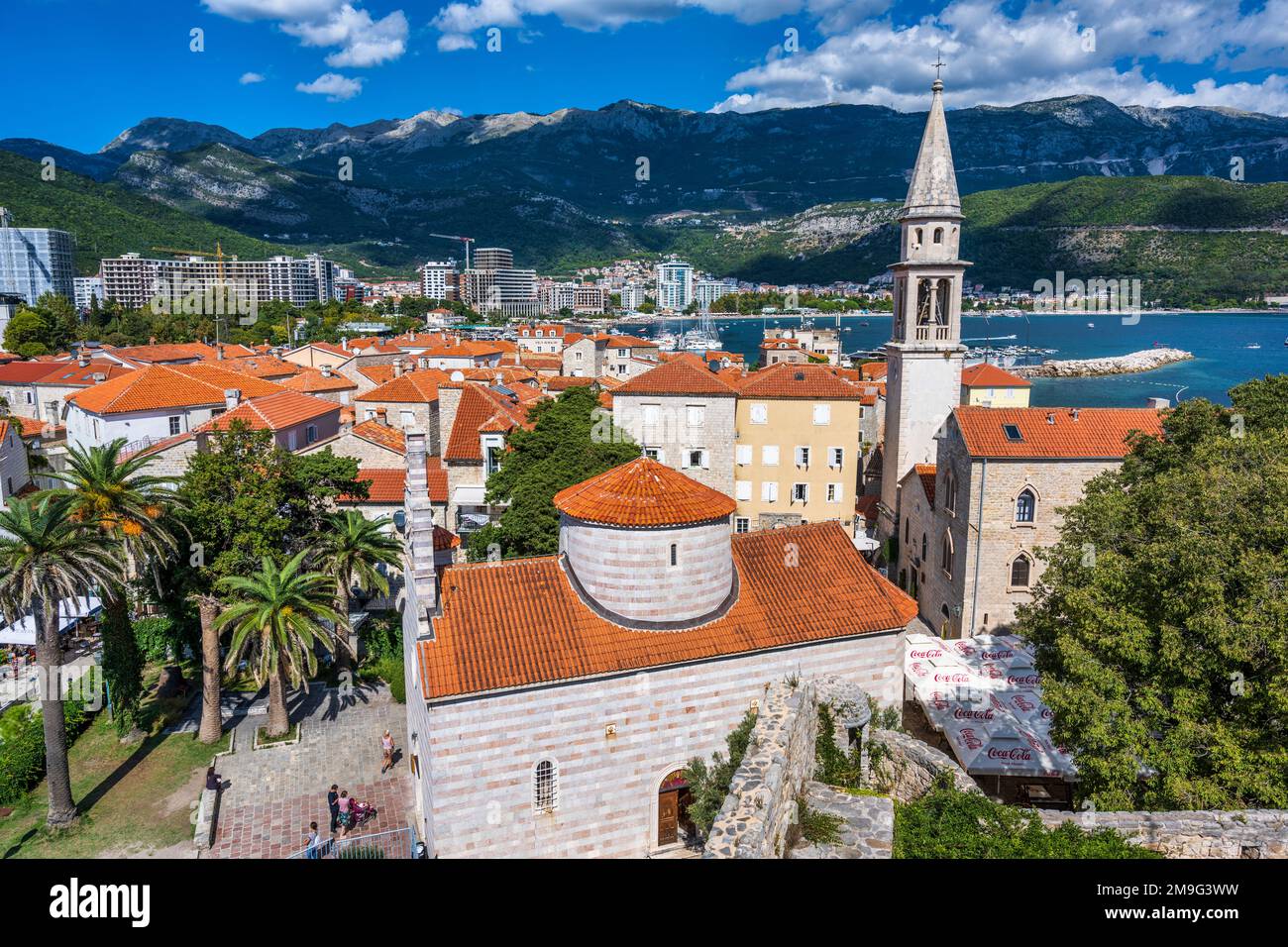 Elevated view of Holy Trinity Church, with bell tower of Saint Ivan Church on the right, in the old town of Budva on the Adriatic Coast of Montenegro Stock Photo