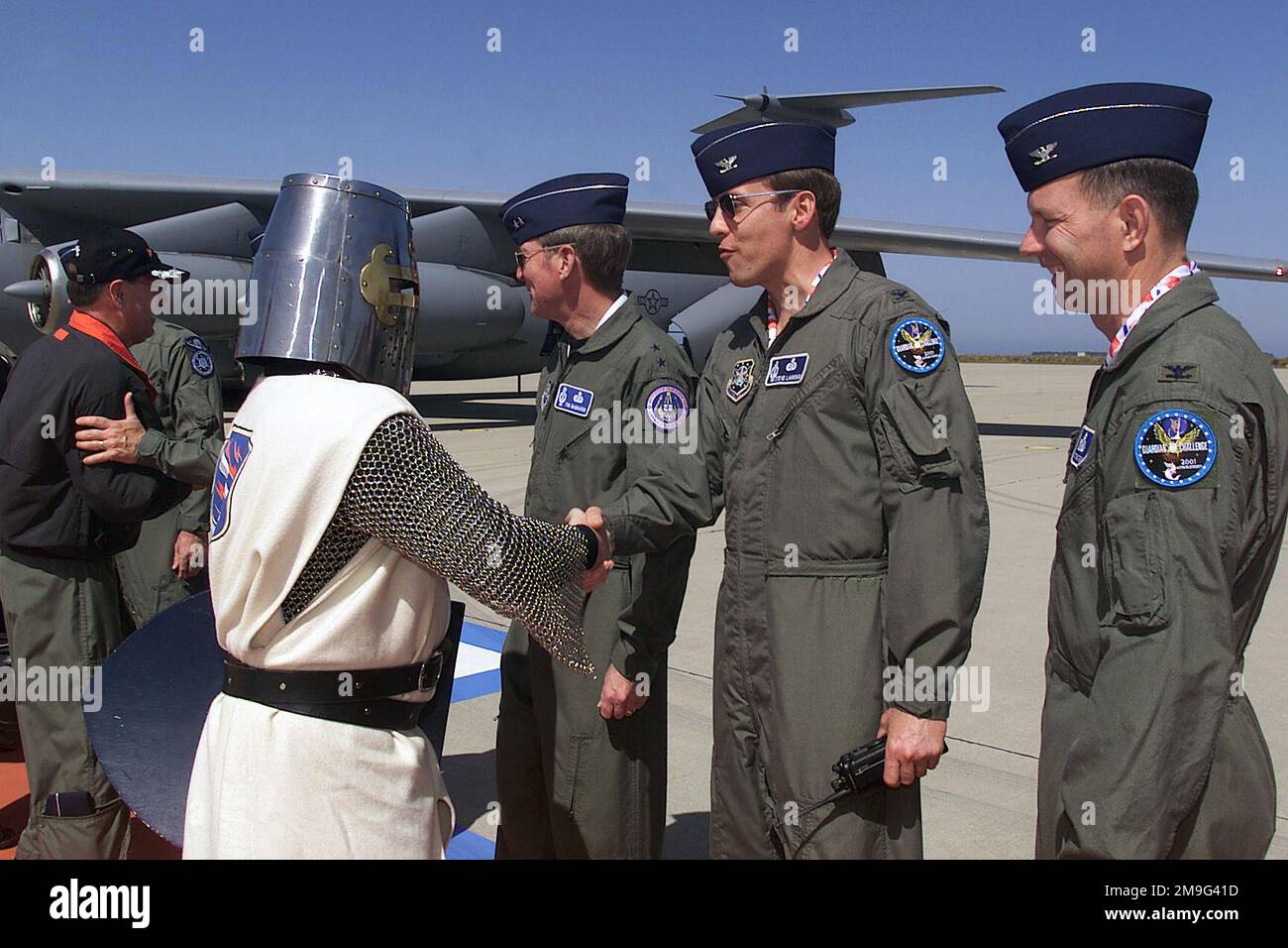 010506-F-3820W-009. [Complete] Scene Caption: Colonel Steve Lanning, USAF, 30th Space Wing commander, greets STAFF Sergeant Barton Bosarge, USAF, as Iron Mike, mascot for the 21st Space Wing Knights of Peterson Air Force Base, Colorado, as he and his unit arrive at Vandenberg Air Force Base, California, for GUARDIAN CHALLENGE 2001. GUARDIAN CHALLENGE, the world's premier space and missile competition, is a four-day event hosted annually at Vandenberg AFB, CA 'to recognize the best and demonstrate the commands warfighting skills. GUARDIAN CHALLENGE creates competition-tough crews; improves read Stock Photo