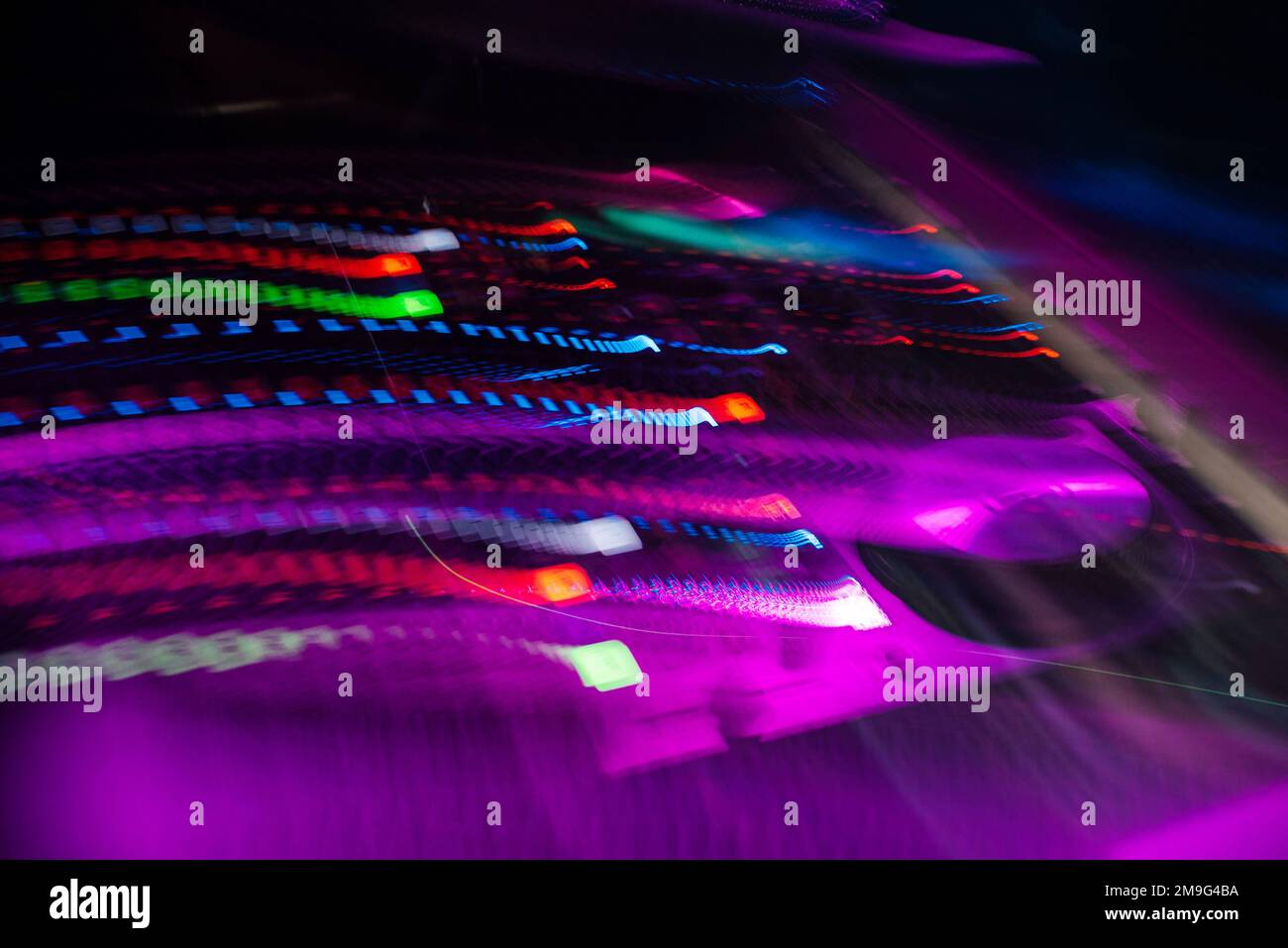 DJ mixer controller Board with color effects from long exposure in a