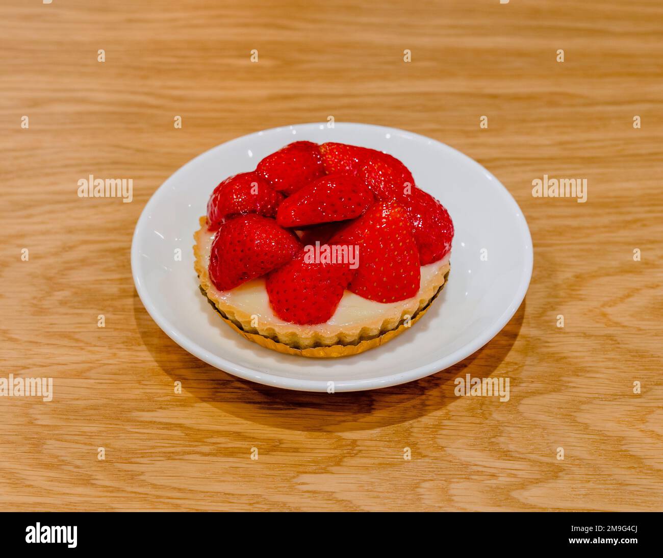 Delicious strawberry shortcake over wooden backgroundd Stock Photo - Alamy