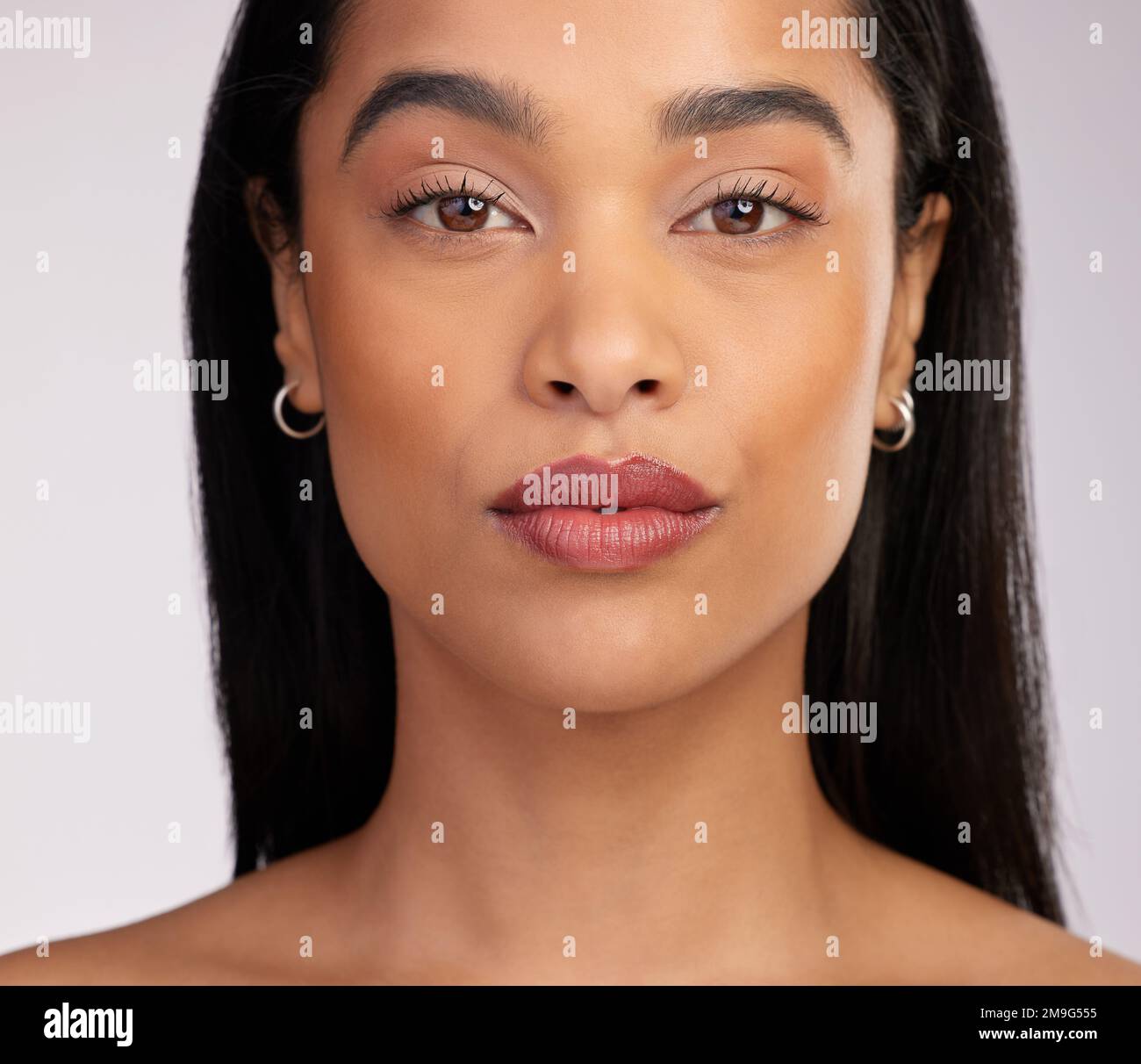 A perfect face, highlighted by her lips. Studio portrait of an