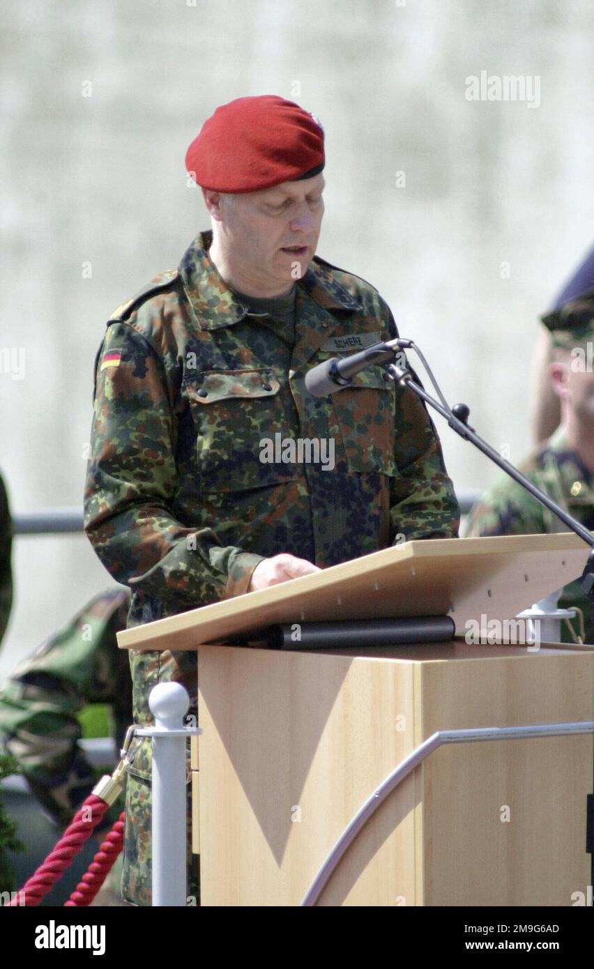German Brigadier General Reimar Scherz, Director Preactivation STAFF Office of Information Management and Information Technology, Bundeswher, addresses the participants of COMBINED ENDEAVOR 2001, during the closing ceremonies. This marks the end of Combined Endeavor in Lager Aulenbach, Germany. Sponsored by US European Command and hosted by Germany, the exercise is held annually to test and document the interoperability of dozens of countires and NATO. This is the largest communications and information systems exercise in the world, 37 countries participated this year. Subject Operation/Series Stock Photo