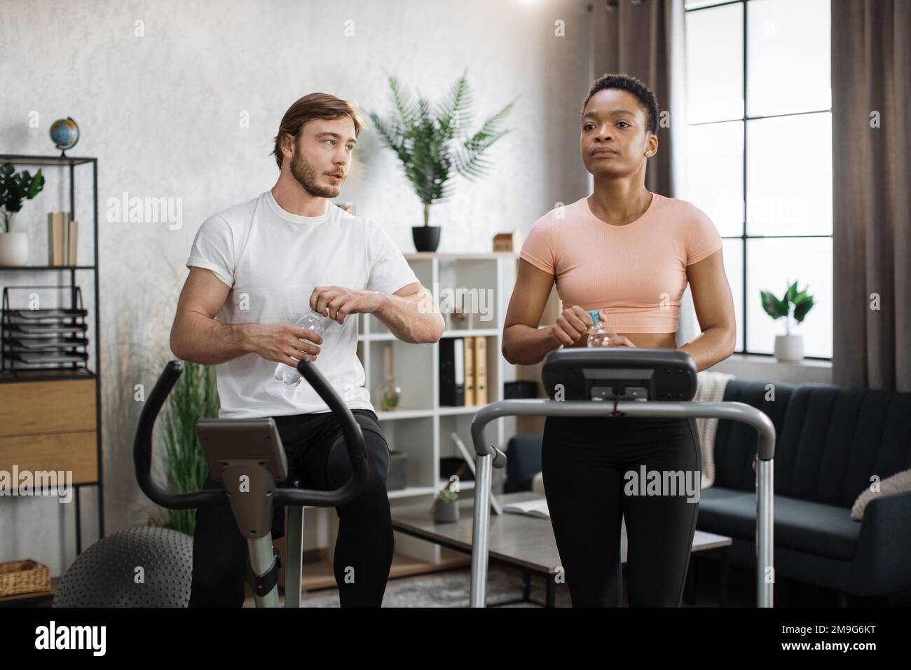 Pretty girl working out in a treadmill at the gym